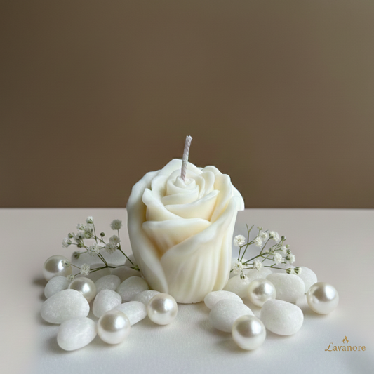 Rose-shaped candle with small white flowers and pearls on a neutral background. Floral sculptural soy wax candle designed for romantic gifting and elegant home décor