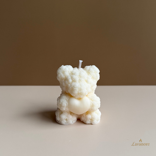 Heartfelt Rose Bear sculptural soy wax candle for romantic gifting and elegant home décor. White bear-shaped candle on a beige surface with a brown background