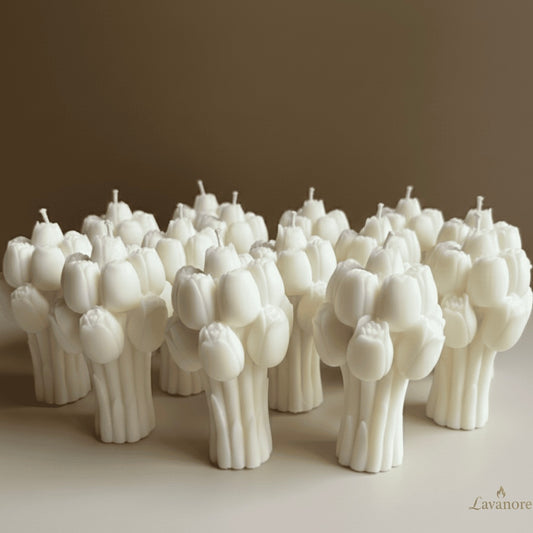Tulip Bouquet sculptural soy wax candle for luxury gifting and elegant home décor . White tulip-shaped candles arranged on a brown surface with 'Lavanore' branding.