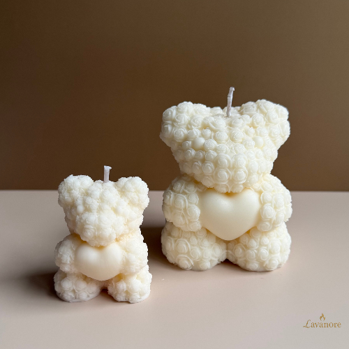 Heartfelt Rose Bear Grande sculptural soy wax candle for romantic gifting and home décor. Two white bear-shaped candles on a beige surface with a brown background