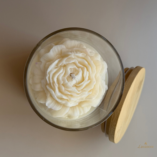Jar of Bloom peony sculptural soy wax candle in glass jar for luxury gifting and décor. Glass candle with wooden lid featuring a floral design on a neutral background