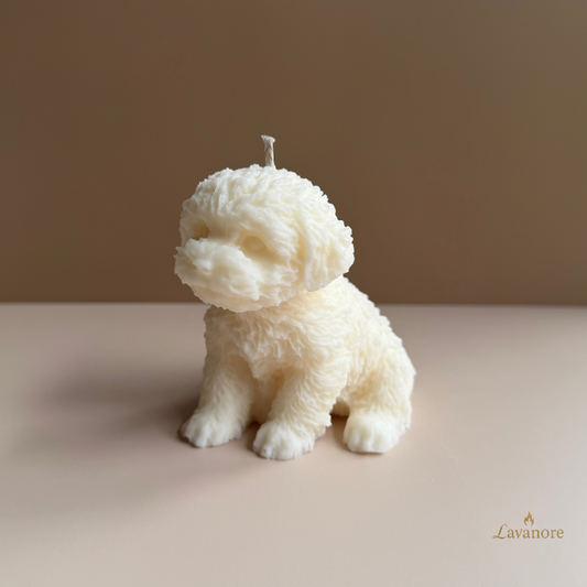 Candle shaped like a dog on a plain background with 'Lavanore' branding. Velour Puppy sculptural soy wax candle designed for luxury gifting and cozy home décor