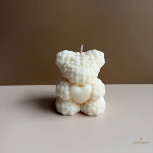 White textured bear-shaped candle on a plain surface with a neutral background.Heartfelt Rose Bear Grande sculptural soy wax candle for romantic gifting and home décor